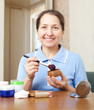 mature woman putting make up