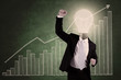 Photo: Successful businessman with profit bar chart Successful businessman with profit bar chart