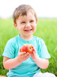 Portrait of a happy little boy with apple