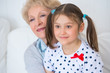 Photo: Lovely little girl with her grandmother having fun and happy mom Lovely little girl with her grandmother having fun and happy mom