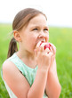 Portrait of a little girl with apple