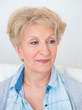 Portrait of an attractive elegant senior woman relaxingand dream