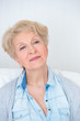 Portrait of an attractive elegant senior woman relaxingand dream