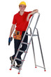 Photo: Man with ladder stood by step-ladder Man with ladder stood by step-ladder