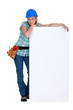 Female worker with a blank board
