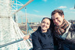 Young Couple having a Ride on a Ferris Wheel