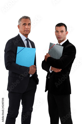 Photo: two businessmen holding folders two businessmen holding folders