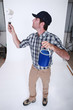 Photo: Decorator with a paint roller Decorator with a paint roller