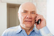  senior man speaking by mobile