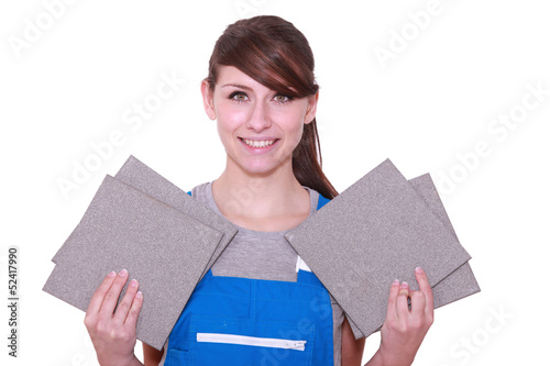 Photo: portrait of a woman holding tiles portrait of a woman holding tiles