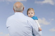 grandfather with granddaughter , outdoors