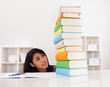 Shocked Woman Looking At Stack Of Books