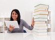 Woman Avoiding Books And Using Tablet