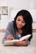 Photo: Young Woman Writing In Diary Young Woman Writing In Diary