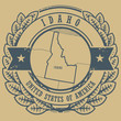 Grunge rubber stamp with name and map of Idaho, USA, vector