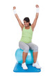 Woman Exercising On Pilates Ball