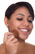 Young Woman Applying Blush