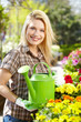 Female florist or gardener in flower shop or nursery