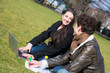 Young Couple with Computer at Park in Wien
