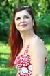 Photo: beautiful young woman in a park beautiful young woman in a park