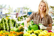 Female florist or gardener in flower shop or nursery