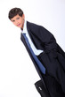 Young boy in his father's business suit