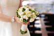Wedding bouquet in hands of the bride