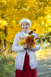 Photo: happy mature woman in autumn park happy mature woman in autumn park