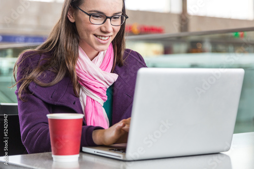 Photo: Young Woman inside Train Station or Airport Young Woman inside Train Station or Airport