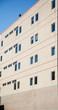 Brown Brick Building with Red Stripes