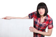 Photo: Brunette stood with advertising board Brunette stood with advertising board