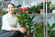 woman in flower shop with anthurium