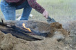 Man Builds Fire Pit Around Open Camp Fire
