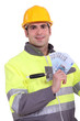 Manual worker holding money