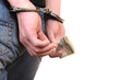 Handcuffs on Hands with Money closeup