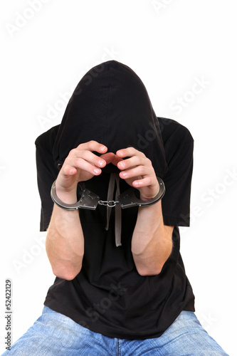 Photo: Young Man in Handcuffs Young Man in Handcuffs