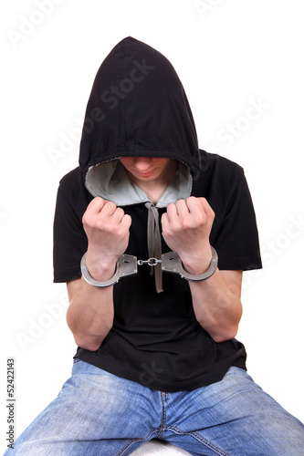 Photo: Arrested Young Man in Handcuffs Arrested Young Man in Handcuffs