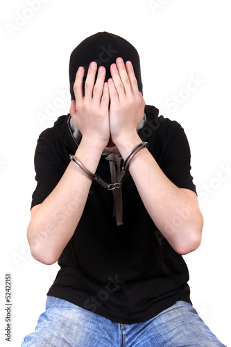 Photo: Man in Handcuffs Hide his Face Man in Handcuffs Hide his Face
