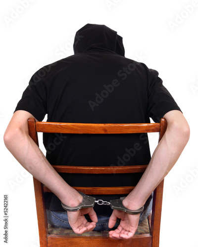 Photo: Man in Handcuffs on the Chair Man in Handcuffs on the Chair