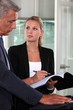 handsome middle-aged businessman with young blonde secretary