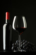 Photo: bottle with red wine and glass and grapes bottle with red wine and glass and grapes