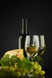 white wine and cheese on black