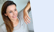 Photo: Relaxed young woman standing at home Relaxed young woman standing at home