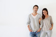 Couple standing on white background