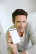 Photo: Man showing smartphone to camera Man showing smartphone to camera