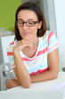 Brunette girl at work with perplexed look