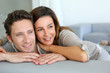 Photo: Portrait of sweet couple sitting in sofa Portrait of sweet couple sitting in sofa