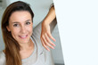 Relaxed young woman standing at home
