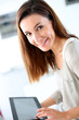 Young woman using electronic tablet