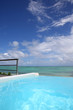 Closeup of infinity pool getting to the sea